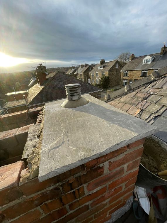 Chimney rebuilt with a new concrete cap