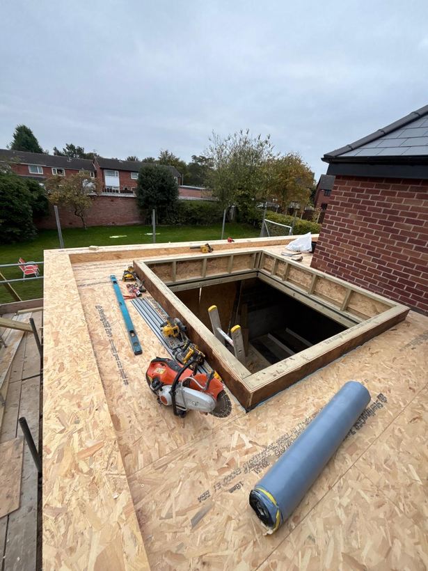 New flat roof deck with the skylight opening framed out