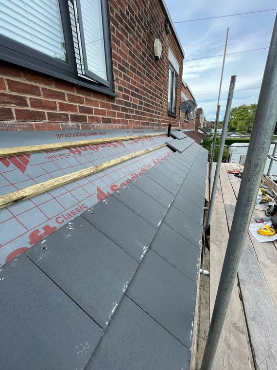 New breathable underlay and battens across the roof